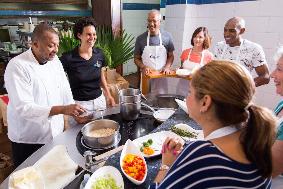 A Bahamian cooking class in Nassau, Bahamas, where participants are preparing traditional Bahamian dishes.