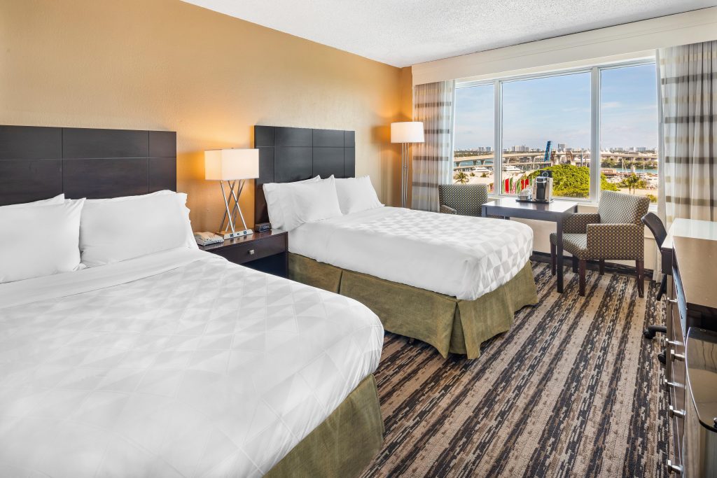 Family-friendly hotel room at Holiday Inn Port of Miami-Downtown with two beds, ideal for parents and kids.