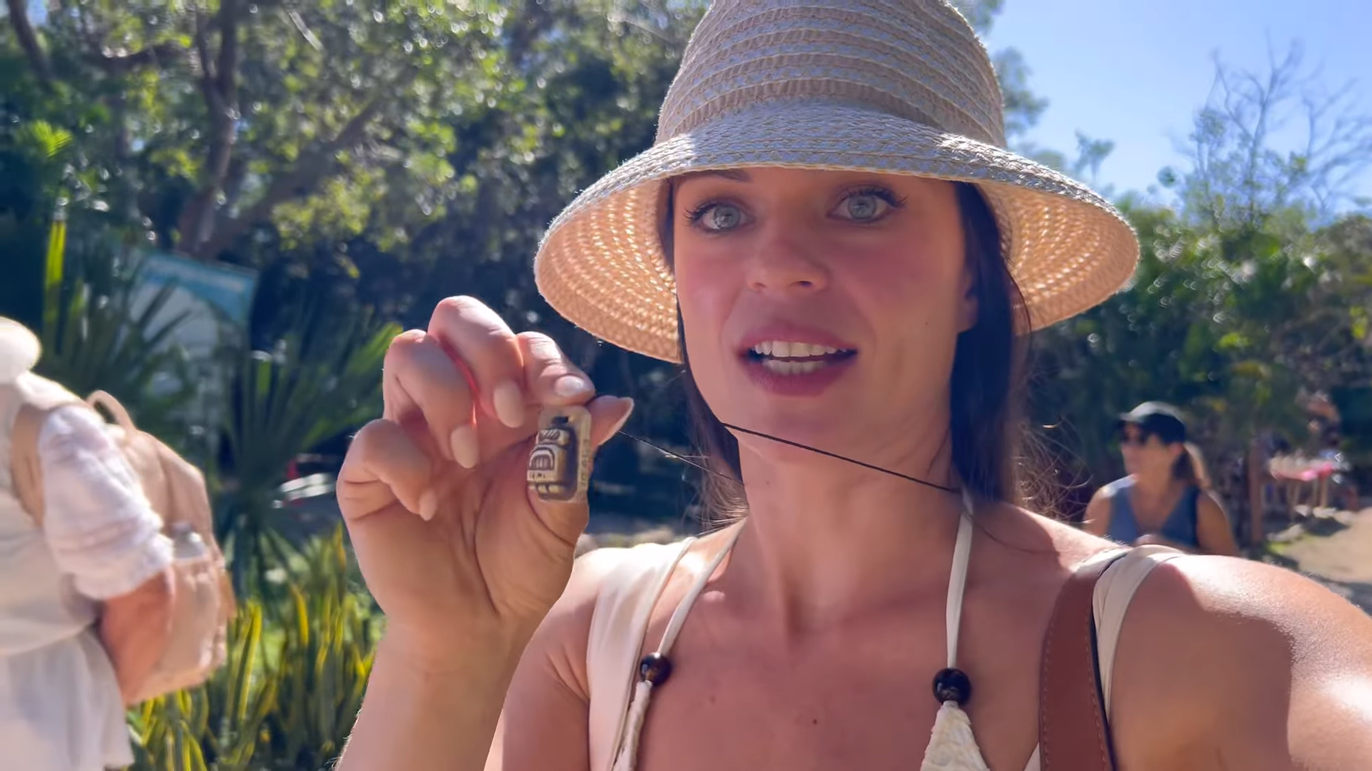 Mariya proudly displays her Mayan zodiac necklace at Ek Balam ruins.