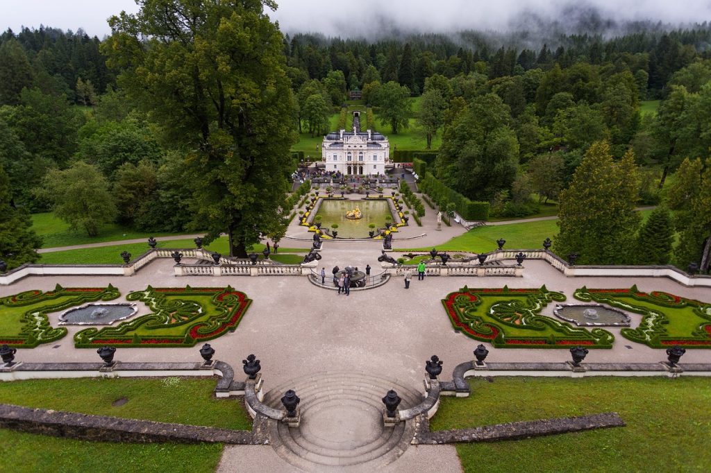 Linderhof Palace, a stunning Bavarian royal residence surrounded by lush gardens and scenic landscapes.